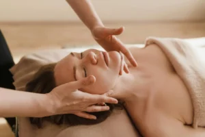 Estetista 3 Woman receiving a soothing facial massage, promoting relaxation and wellness.